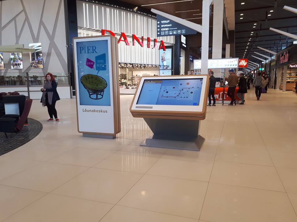 wayfinder kiosk near digital signage display